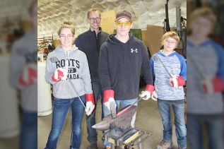 Class was in session last Saturday as master sculptor Stefan Duerst has being holding classes for kids. Here the Perry kids (Kaitlyn, Grant and Mason) are going through the various steps to create pokers and hooks. Photo/Craig Bakay
